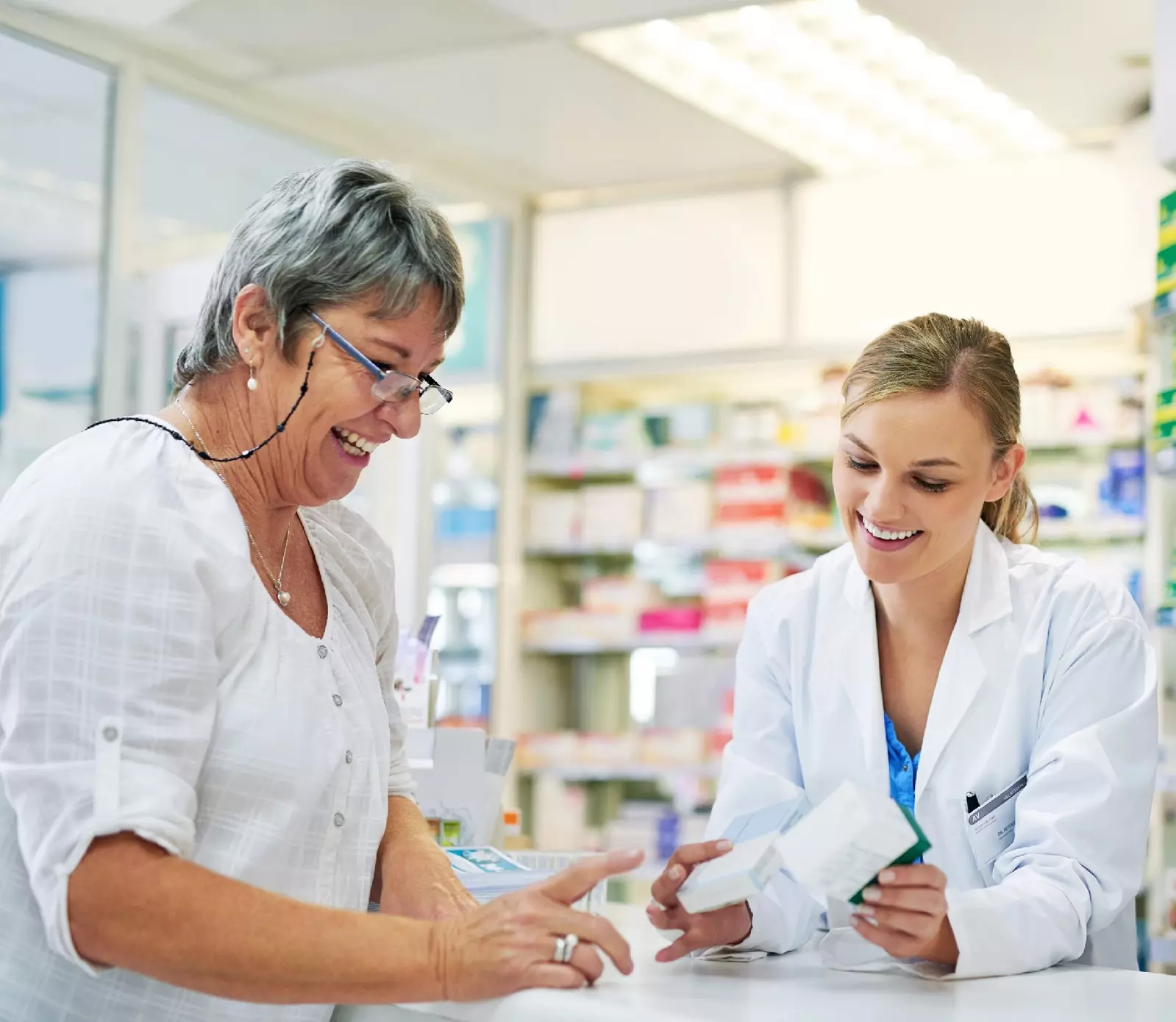 pharmacist discussing prescription with patient